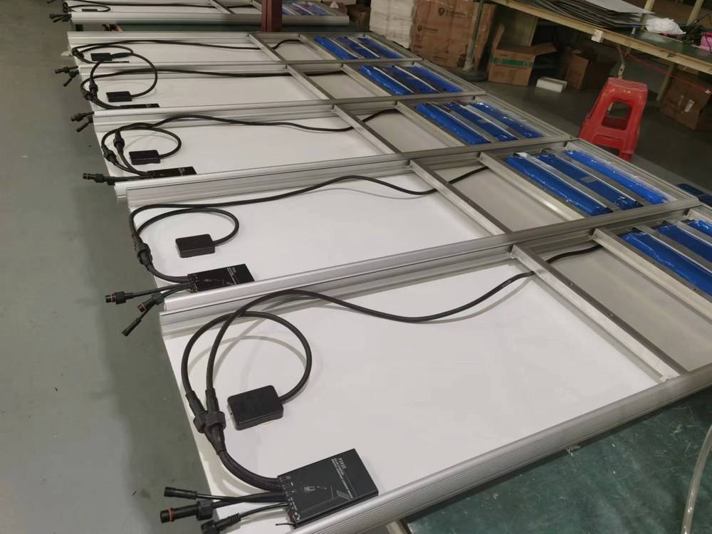 Wiring and connection check on solar panels before assembly